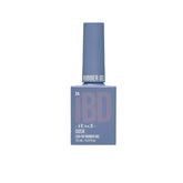 IBD Dusk Rubber Gel in a dusky blue bottle, offering a moody yet elegant color for nail art.